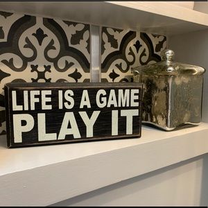 “Life Is A Game, Play It” Decorative Sign
